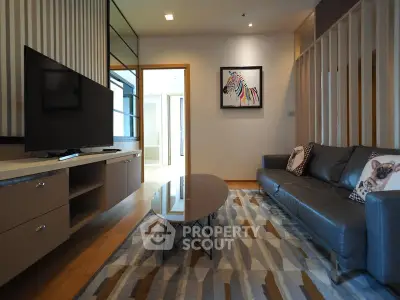 Modern living room with stylish decor and comfortable seating in a contemporary apartment.