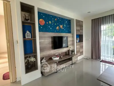 Modern living room with stylish TV unit and planetary wall art