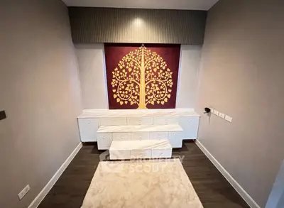 Elegant interior with artistic wall decor and stylish cabinetry in a modern living space.