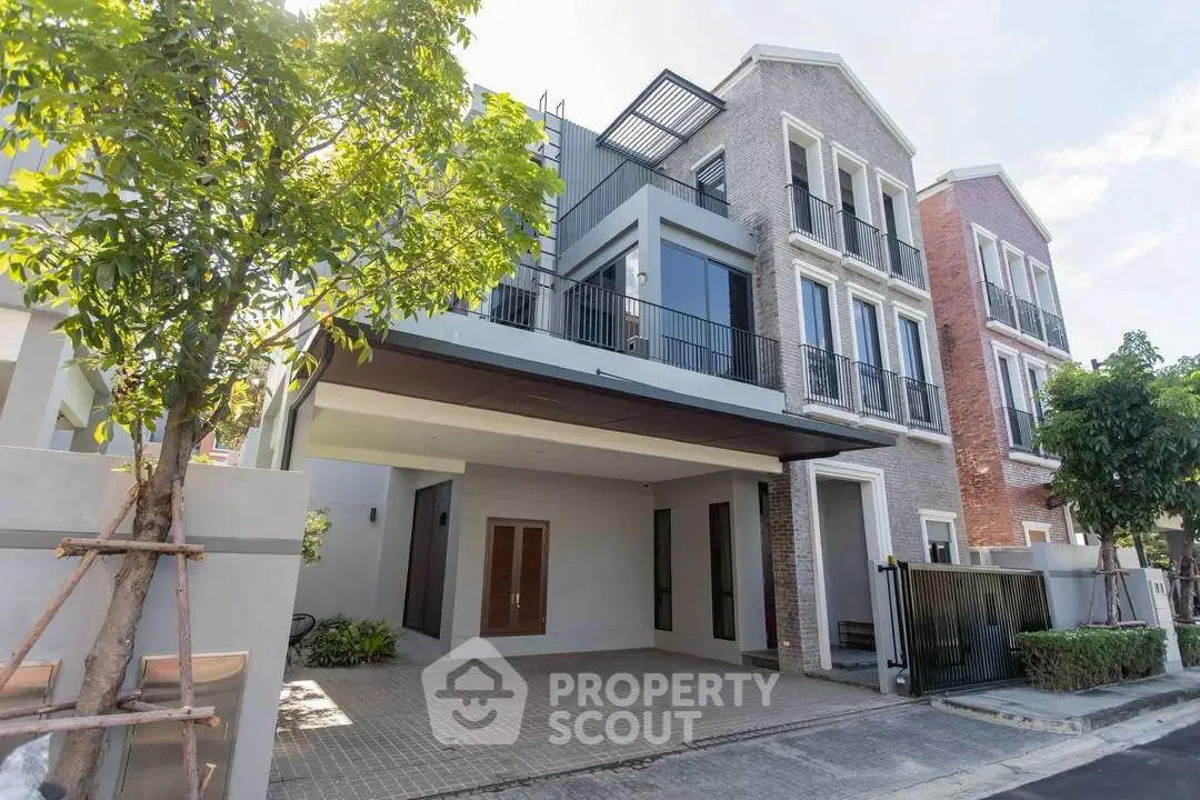 Modern townhouse with spacious driveway and contemporary facade in a serene neighborhood.