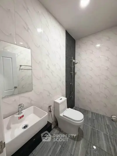 Modern bathroom with sleek fixtures and elegant marble tiles