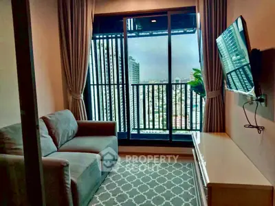 Cozy living room with city view balcony, modern sofa, and wall-mounted TV.