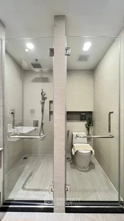 Modern bathroom with glass shower and sleek fixtures