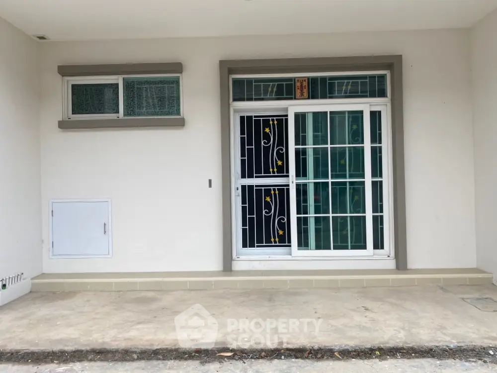 Modern house exterior with secure window grills and minimalist design