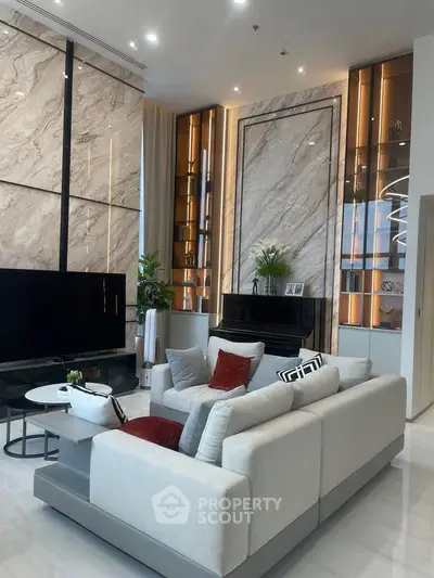 Luxurious modern living room with elegant marble walls and stylish furniture