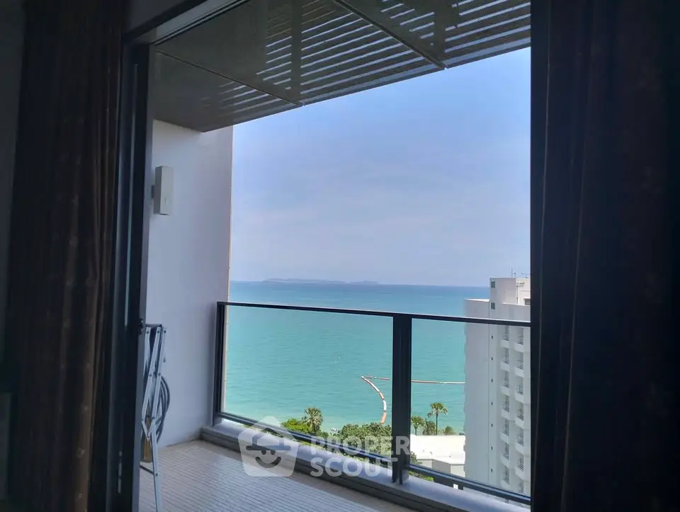 Stunning ocean view from a high-rise balcony, perfect for relaxation and enjoying the sea breeze.
