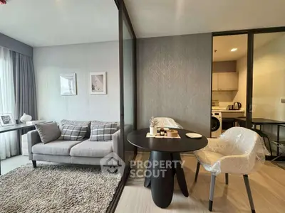 Modern living room with cozy sofa and dining area in stylish apartment