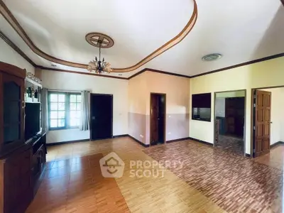 Spacious living room with elegant ceiling design and natural light