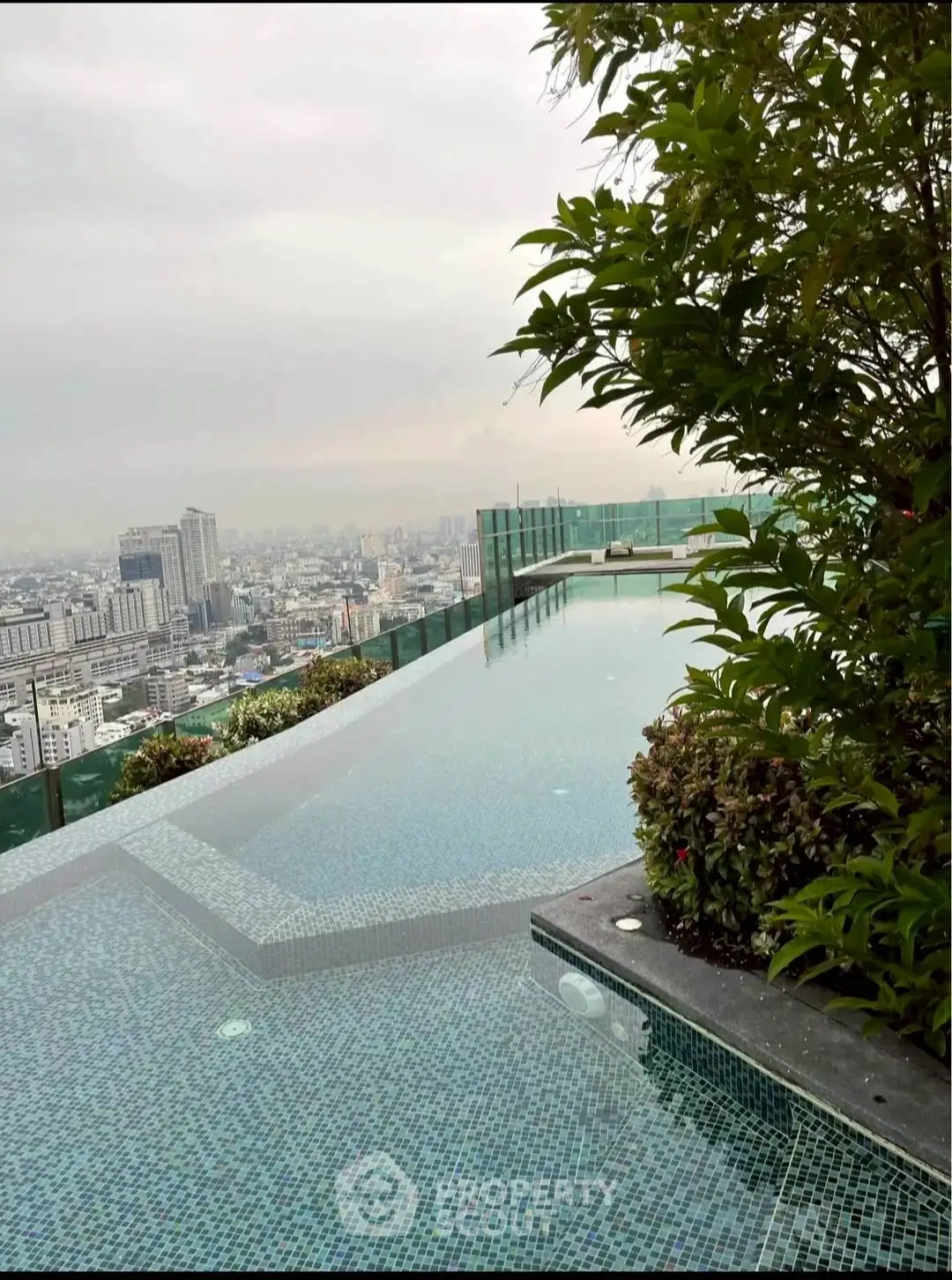 Luxurious rooftop infinity pool with stunning cityscape view