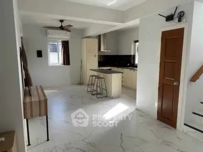 Modern kitchen with island and sleek design in open layout