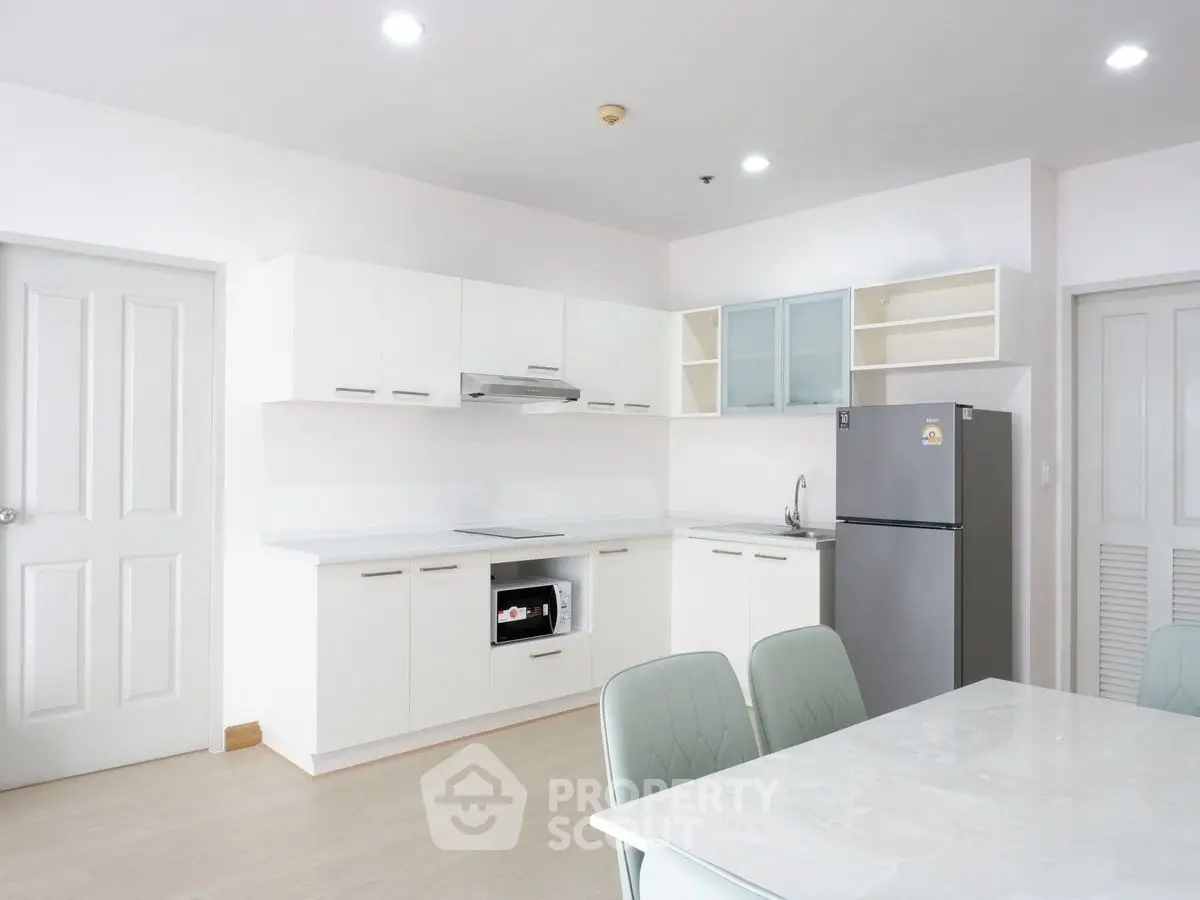 Modern kitchen with sleek cabinets and stainless steel appliances