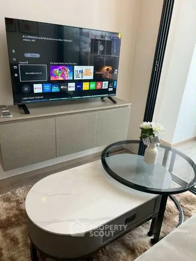 Modern living room with sleek TV setup and stylish coffee table
