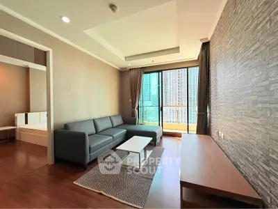 Modern living room with sleek furniture and city view, featuring a spacious layout and stylish decor.