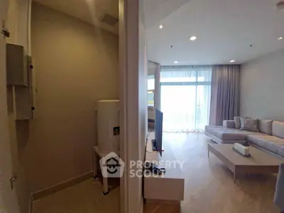 Modern living room with natural light and cozy seating area