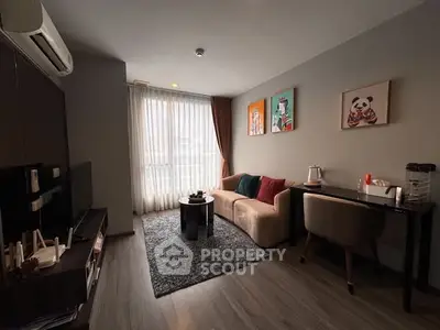 Modern living room with cozy sofa, stylish decor, and natural light through large window.