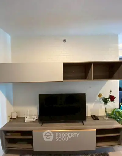 Modern living room with sleek TV unit and stylish shelving, perfect for contemporary living.