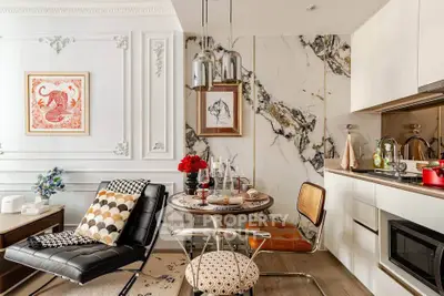 Stylish modern kitchen with marble accents and chic dining area
