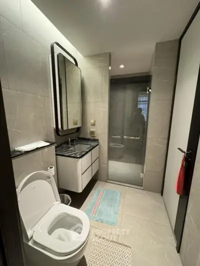 Modern bathroom with sleek design and glass shower enclosure