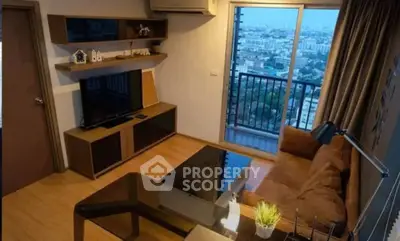 Modern living room with city view, featuring stylish furniture and a cozy atmosphere.