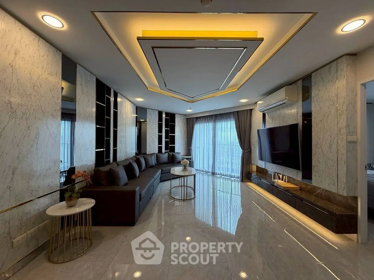 Luxurious modern living room with sleek design and large windows offering stunning views.