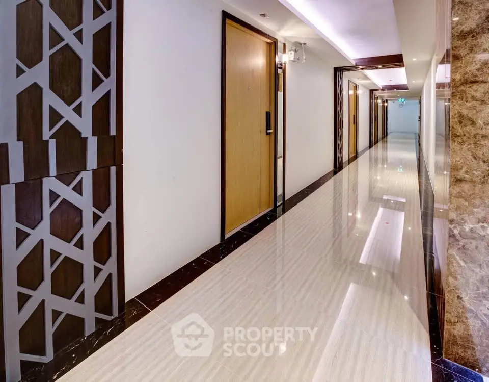 Modern apartment hallway with polished floors and stylish decor