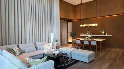 Luxurious modern living room with high ceilings and elegant dining area, perfect for entertaining.