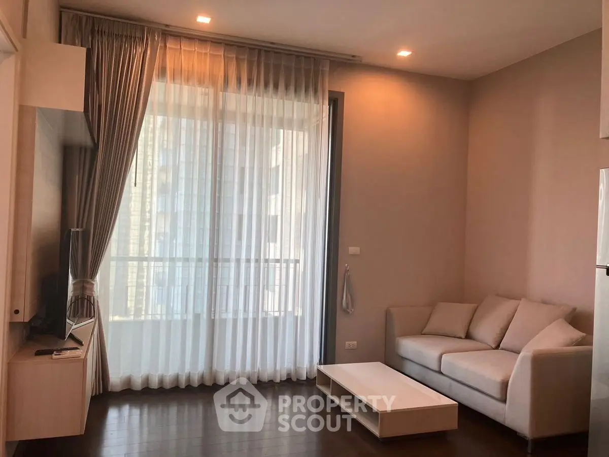 Modern living room with elegant curtains and cozy sofa in a bright apartment