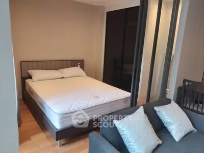 Modern studio apartment with cozy bedroom and stylish living area