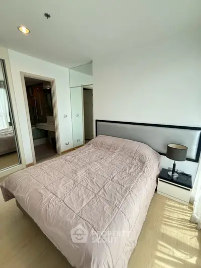 Modern bedroom with cozy bed and stylish decor in a bright apartment