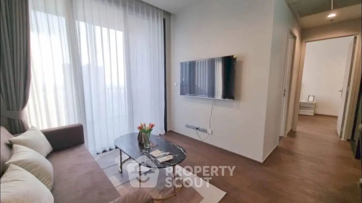 Modern living room with wall-mounted TV and elegant decor