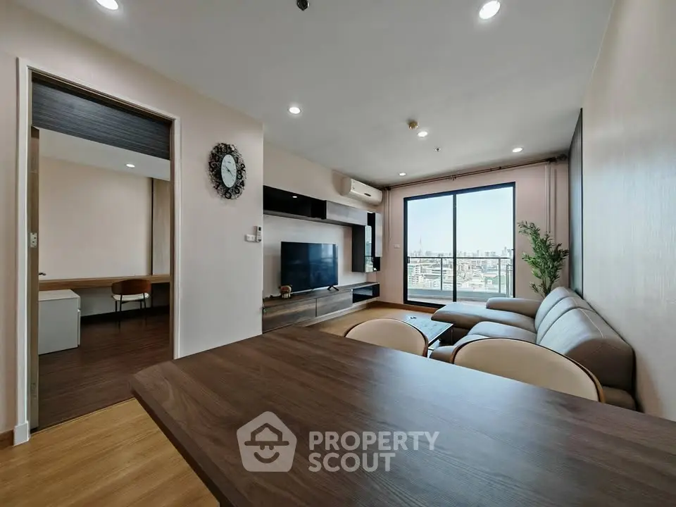 Modern living room with city view, stylish furniture, and open layout for comfortable living.
