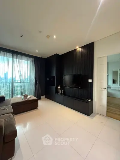 Modern living room with sleek black accent wall and city view