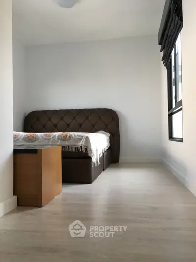 Cozy bedroom with modern bed and natural light
