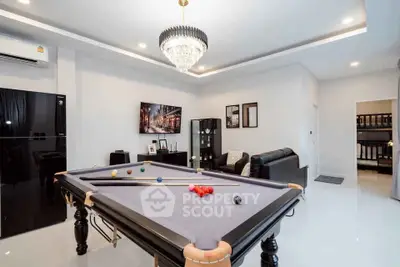 Luxurious living room with pool table and modern decor