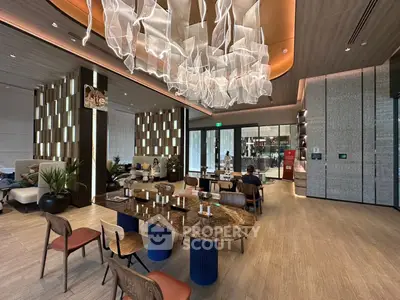 Luxurious modern living room with elegant chandelier and stylish furniture