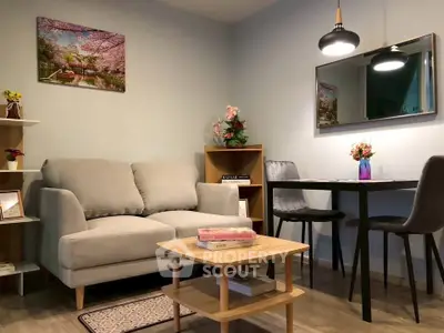 Cozy living room with modern decor and dining area, perfect for relaxation and entertaining.