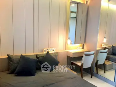 Modern bedroom with stylish decor and mirrored wardrobe