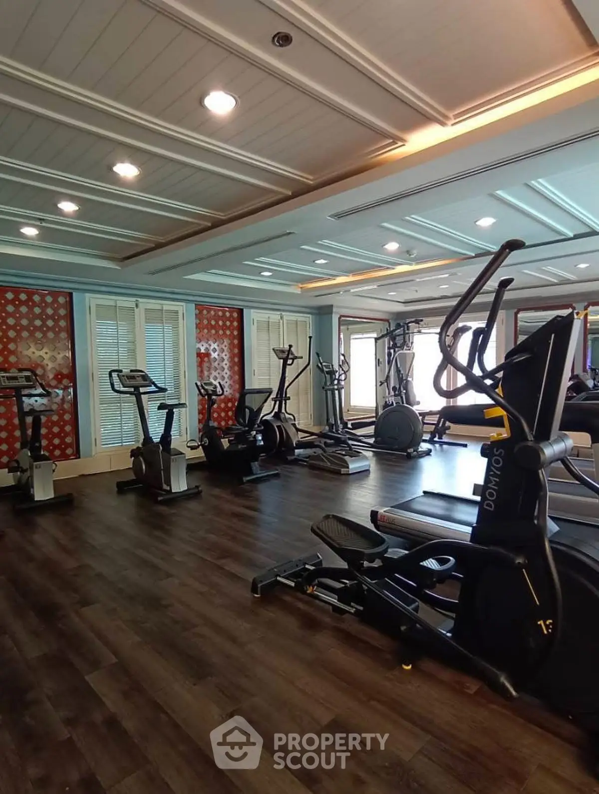 Luxurious gym with modern equipment and elegant interior design, perfect for fitness enthusiasts.