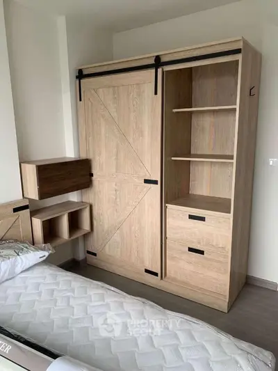 Modern bedroom with stylish wooden wardrobe and cozy bed setup.