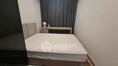 Cozy bedroom with modern furnishings and elegant curtains