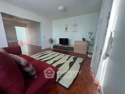 Spacious living room with modern decor and natural light