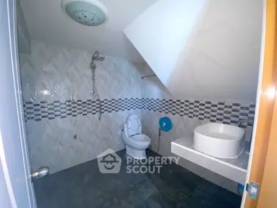 Modern bathroom with stylish tiles and sleek fixtures