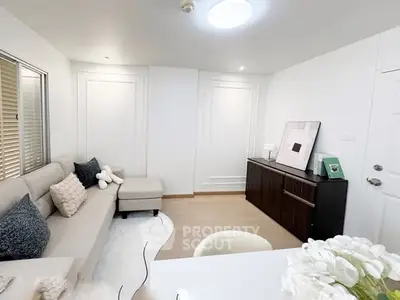 Modern living room with elegant decor and cozy seating area