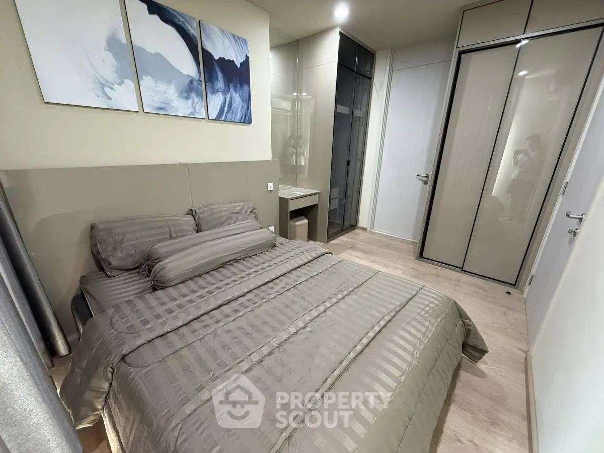 Modern bedroom with sleek design and ample storage space