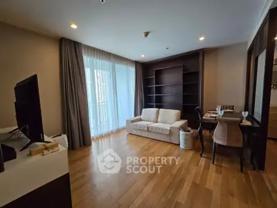 Spacious living room with elegant wooden flooring and cozy seating area