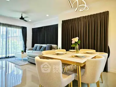 Modern living room with elegant dining area and large windows