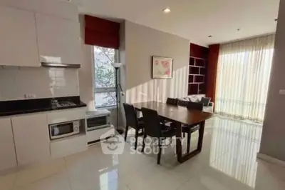 Spacious modern living room with dining area and natural light