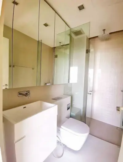 Modern bathroom with sleek fixtures and glass shower enclosure