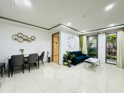 Modern living room with stylish decor and garden view, featuring sleek furniture and elegant design.