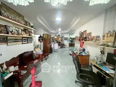 Spacious living room with eclectic decor and ample natural light